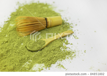 matcha green detox tea scattered with dry wooden spoon and bamboo whisk matcha green detox tea scattered with dry wooden spoon and bamboo whisk 84851802