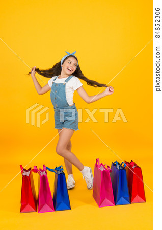 Cosmetics shop. Little girl with shopping packages. Cosmetics shop. Little girl with shopping packages. 84852306