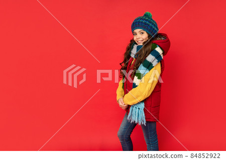 female fashion model. teen girl in scarf. child wearing warm clothes. express positive emotion. female fashion model. teen girl in scarf. child wearing warm clothes. express positive emotion. 84852922
