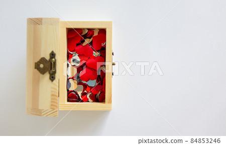 Image of many small heart in wooden chest. Beautiful white background, copy space. 84853246