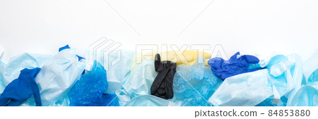 Waste of used personal protective equipment PPE gloves, disposable masks, shoe covers of medical workers in the form of a background. Garbage contamination after the COVID-19 pandemic Waste of used personal protective equipment PPE gloves, disposable masks, shoe covers of medical workers in the form of a background. Garbage contamination after the COVID-19 pandemic 84853880