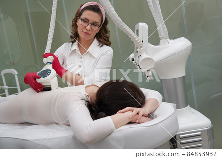 Beautiful woman getting beauty cellulite therapy Beautiful woman getting beauty cellulite therapy 84853932