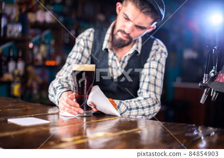 Barman concocts a cocktail at the brasserie 84854903