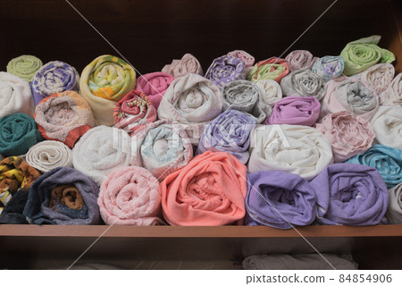 Towels and bed linen are folded in a certain way. Storage system, cabinet. Ventilation. Towels are stored in tubes. Towels and bed linen are folded in a certain way. Storage system, cabinet. Ventilation. Towels are stored in tubes. 84854906