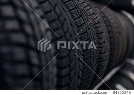 car tires on a rack in a car store car tires on a rack in a car store 84855849