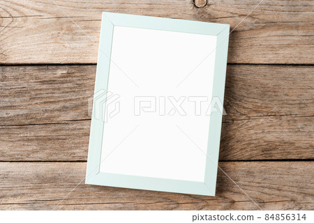 Photo frame with copyspace on wooden background Photo frame with copyspace on wooden background 84856314