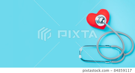 Red heart with stethoscope on blue background with copy space, heart health, health insurance concept, World heart day, world health day Red heart with stethoscope on blue background with copy space, heart health, health insurance concept, World heart day, world health day 84859117