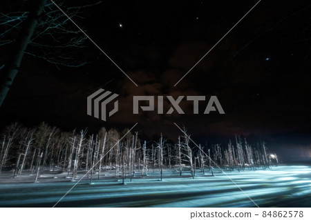 Illuminated winter Biei town, blue pond 84862578