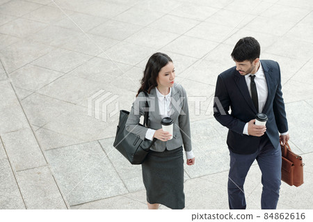Talking Business People Walking Outdoors 84862616