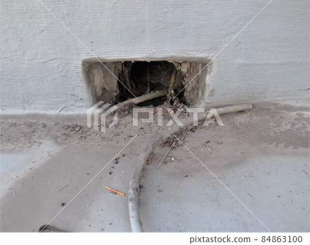 Drainage outlet on the roof of a building, clogging with garbage, corrosion, leaking rain, pool condition Drainage outlet on the roof of a building, clogging with garbage, corrosion, leaking rain, pool condition 84863100