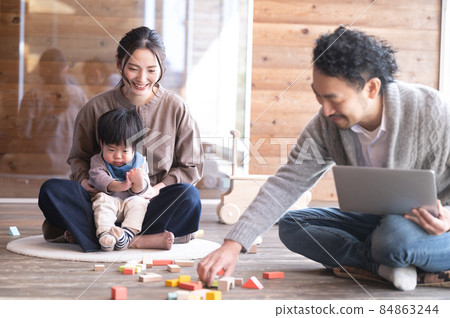 Daddy playing with baby while doing remote work 4 Copy space available Daddy playing with baby while doing remote work 4 Copy space available 84863244