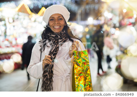 Emotional portrait of woman shopping at Christmas market Emotional portrait of woman shopping at Christmas market 84866949