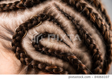Close-up of braids on the head of a caucasian woman. Close-up of braids on the head of a caucasian woman. 84868107