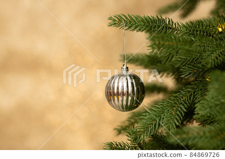 Closeup of Christmas balls on christmas tree. New Year concept. Closeup of Christmas balls on christmas tree. New Year concept. 84869726