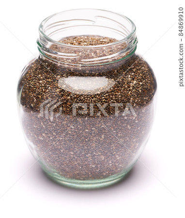glass can full of organic natural chia seeds close-up isolated on white background glass can full of organic natural chia seeds close-up isolated on white background 84869910