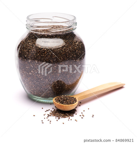 glass can full of organic natural chia seeds close-up isolated on white background 84869921