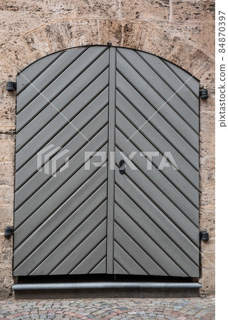 Old wooden door in Old Riga, Latvia Old wooden door in Old Riga, Latvia 84870397