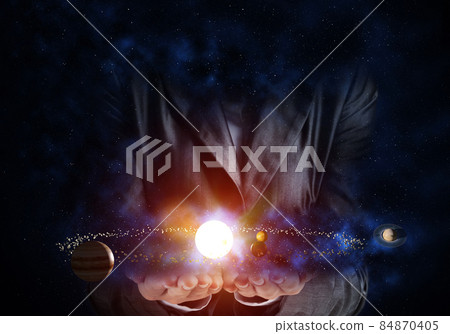 Businessman presenting solar system. 84870405