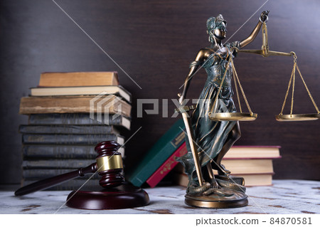 Scales of Justice, Lady Justice, law library concept, Law books in the background. Scales of Justice, Lady Justice, law library concept, Law books in the background. 84870581