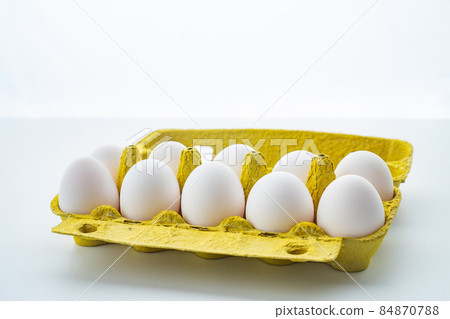 Open egg box with ten eggs isolated on white background 84870788