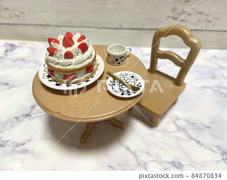 Eating a large whole cake alone 84870834