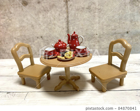 Image photo of enjoying tea time with a fashionable tea set Image photo of enjoying tea time with a fashionable tea set 84870841