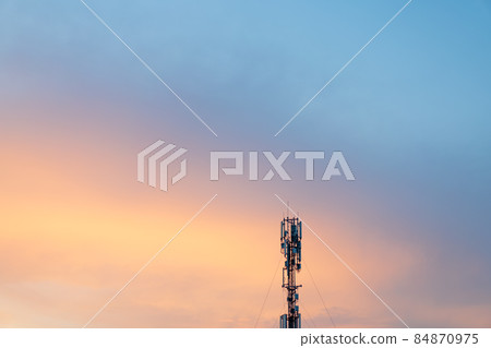 Cell Tower Silhouette Against Orange Sunset Communication Tower Technology Concept Cell Tower Silhouette Against Orange Sunset Communication Tower Technology Concept 84870975