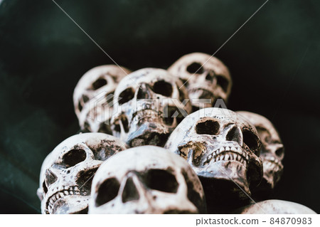 Skull Halloween Background Many People Skulls Stand on top of each other. Mystic creepy concept. Abstract nightmare occult memorial 84870983