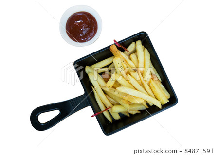 French fried in black plate with tomato sauce French fried in black plate with tomato sauce 84871591