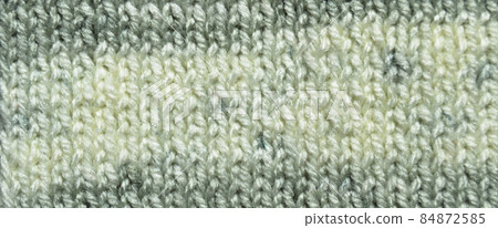 Handmade knitted fabric grey wool background texture 84872585