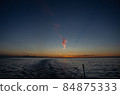 Sea, wake waves and sunrise 84875333
