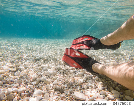man legs in flippers underwater man legs in flippers underwater 84876098