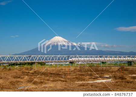 Tokaido Shinkansen passing through the Fujikawa Bridge with Mt. Fuji in the background 84876737