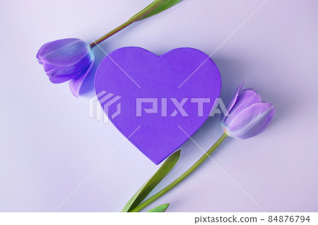 Valentine's day concept. Purple heart and tulips. Trendy color of the year 2022. Greeting card, place for text. 84876794