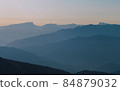 Mountain silhouettes layers in the sunset light 84879032