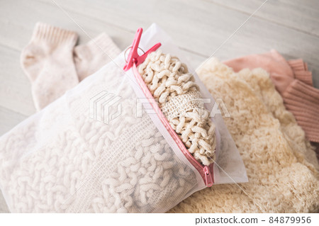 Washing knits and sweaters Image material for washing winter clothes 84879956