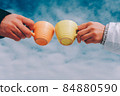 Two cups of coffee in the hands of in love couple. winter theme 84880590