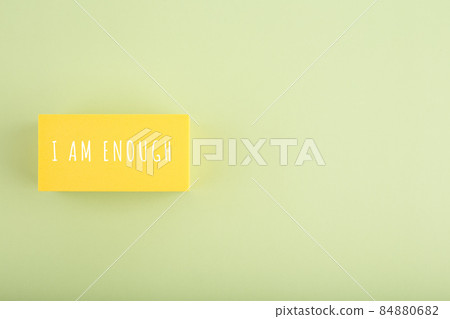 I am enough and self acceptance minimal concept on bright beige background with copy space I am enough and self acceptance minimal concept on bright beige background with copy space 84880682