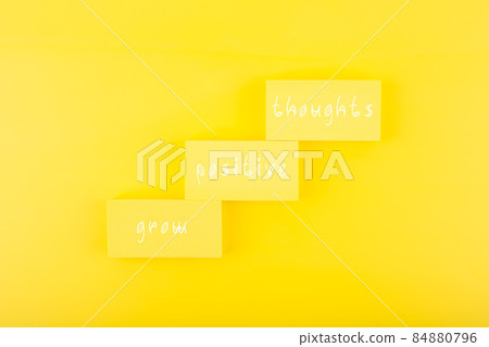 Positive affirmation or quote concept. Grow positive thoughts on yellow background with copy space 84880796