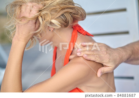 Blonde woman turning her head feeling offended 84881687