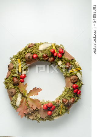 Handmade autumn wreath from natural materials on white background 84882392