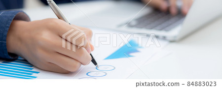 Young asian business man pointing document data graph and chart with pen. Young asian business man pointing document data graph and chart with pen. 84883023