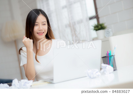 Young asian woman confident working at home with laptop computer. Young asian woman confident working at home with laptop computer. 84883027