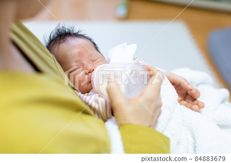 Breastfeeding mom and 1 month old baby Breastfeeding mom and 1 month old baby 84883679
