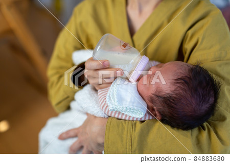 Breastfeeding mom and 1 month old baby Breastfeeding mom and 1 month old baby 84883680