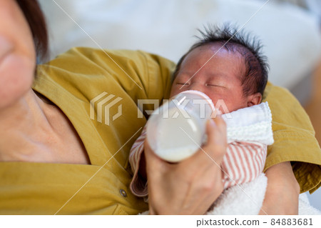 Breastfeeding mom and 1 month old baby Breastfeeding mom and 1 month old baby 84883681