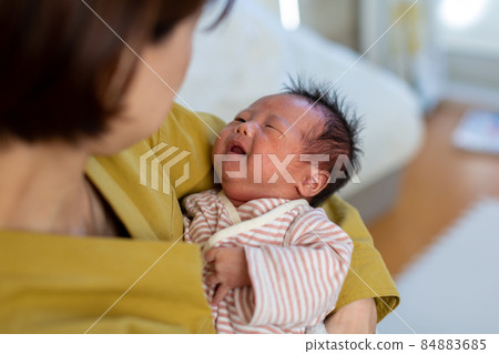 Breastfeeding mom and 1 month old baby Breastfeeding mom and 1 month old baby 84883685
