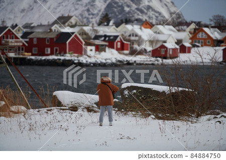 Traditional Norwegian fisherman's cabins and boats 84884750
