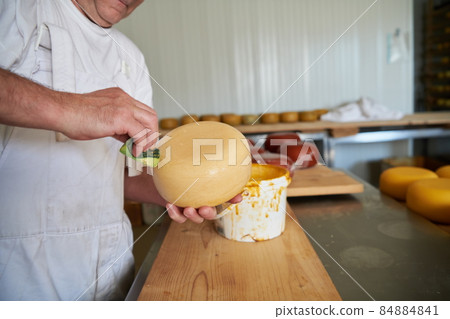 Cheese maker at local production factory Cheese maker at local production factory 84884841