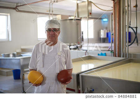 Cheese production cheesemaker working in factory 84884881